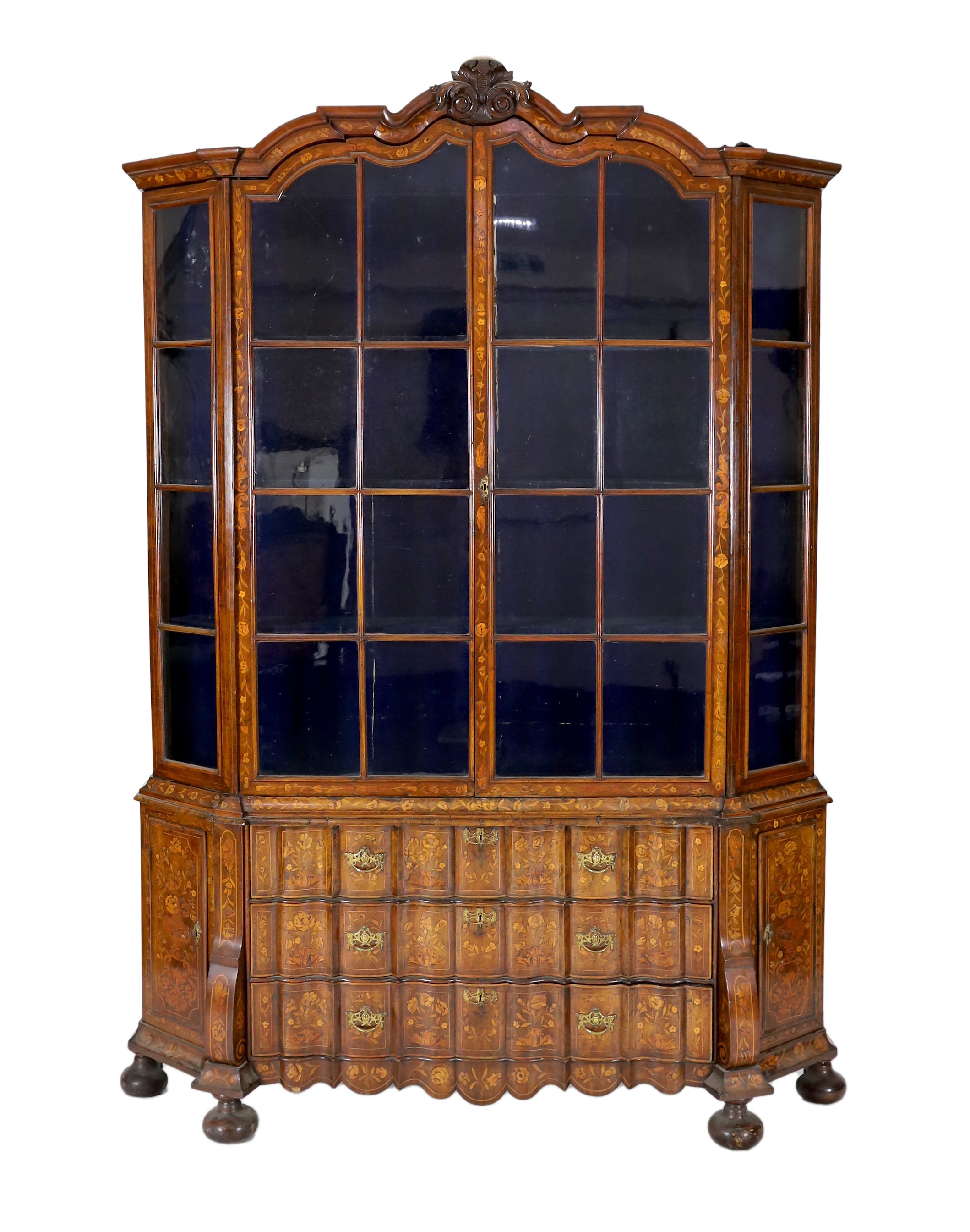 A late 18th century Dutch marquetry inlaid walnut serpentine display cabinet, width 186cm depth 36cm height 260cm